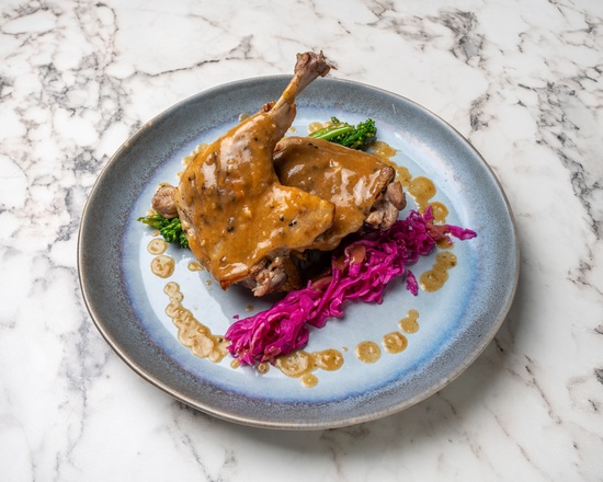 Confit duck leg with red cabbage and broccolini