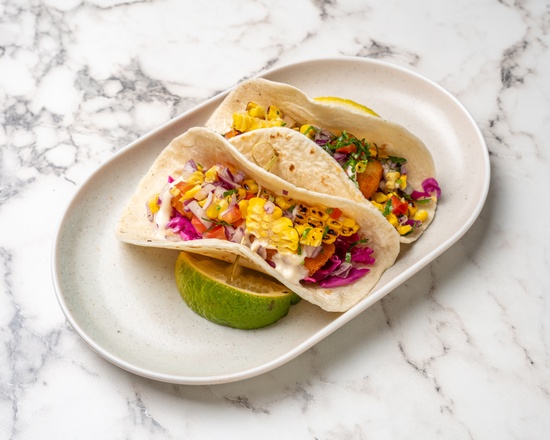 Fish tacos with corn salsa and lime